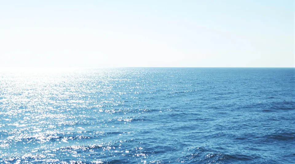 AI-generated illustration: an open ocean horizon with a gentle swell