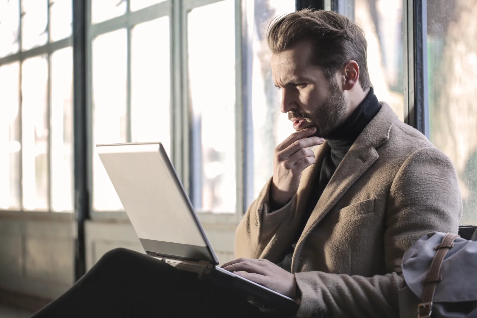 man looking at laptop