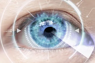 Close-up of human eye with digital graphics for vision analysis